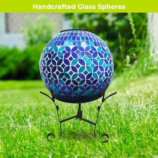 Geometric blue solar LED glass gazing ball on stand with mosaic pattern and vibrant blue tones.