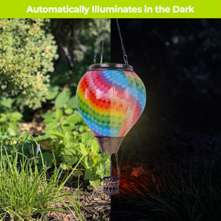 Colorful Patchwork Solar Balloon Lantern with vibrant tie-dye pattern, hanging outdoors, shining bright at night.