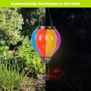 Multicolor Solar Balloon Lantern with solar panel on top, hanging outdoors with vibrant red, yellow, blue, purple.