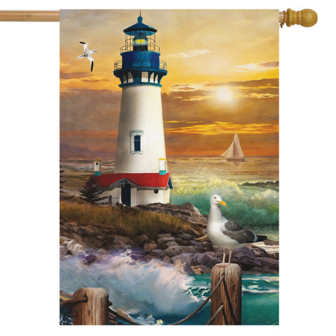 Briarwood Lane Sunset Lighthouse flag on sand by ocean with umbrella and seagull on shore.