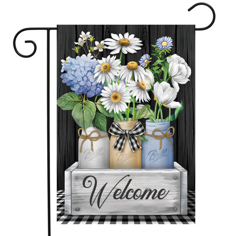 Briarwood Lane Crated Mason Jars with colorful flowers and bow on a welcome garden flag display.