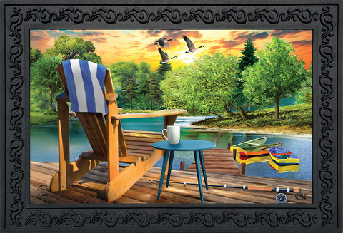 Briarwood Lane Lakeside Escape Summer Doormat with serene lake scene and wooden dock furniture depicted.
