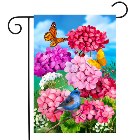 Briarwood Lane garden flag with pink geraniums, blue jay, butterflies, and colorful spring flowers.