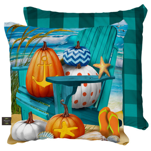 Briarwood Lane Fall At The Beach Pillow with pumpkins and starfish on a green chair.