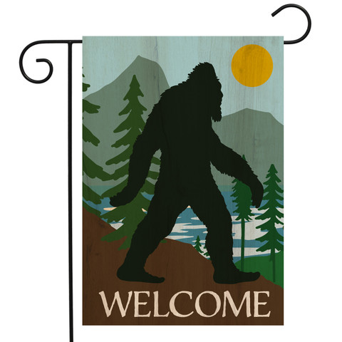 Briarwood Lane Bigfoot Welcome Garden Flag with silhouette of Bigfoot and welcome text on brown background.