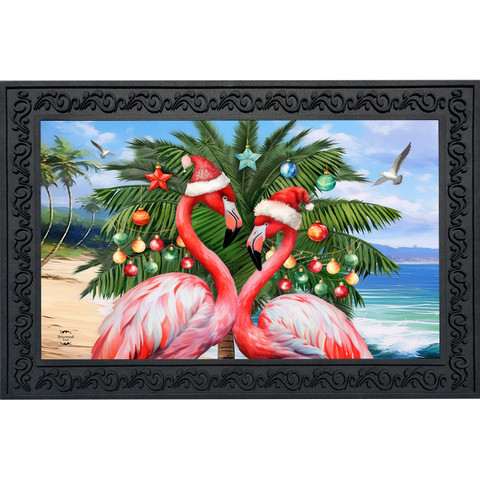 Festive Flamingos Doormat, pink flamingos wearing Santa hats, decorated palm tree, beach background, colorful ornaments.