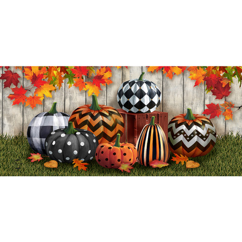 Patterned Pumpkins Mini Mat with various colorful designs on pumpkins against a wooden fence background.