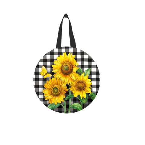 Black and white checkered tote bag with bright yellow sunflowers and green leaves design.