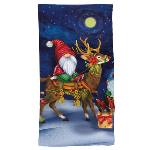Happy Holiday Gnomes cotton hand towel with gnome riding reindeer under starry night sky with moon.