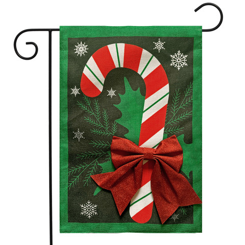 Festive Candy Cane Burlap Garden Flag with red bow and green border on white background.