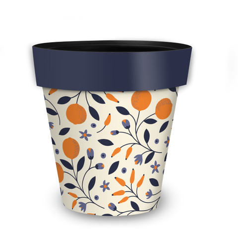 Citrus and Vines medium planter with orange, blue, and purple floral pattern and dark blue rim.