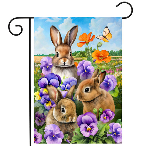 Spring Bunny Trio Garden Flag with three brown bunnies, purple flowers, and orange butterfly outdoors.