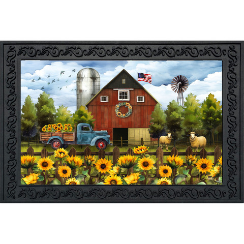 Sunflower Barn Doormat with red barn, blue truck, sunflowers, sheep and American flag design.