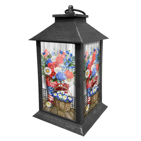 Red White and Beautiful Lantern with patriotic floral design on glass panels in black metal frame.