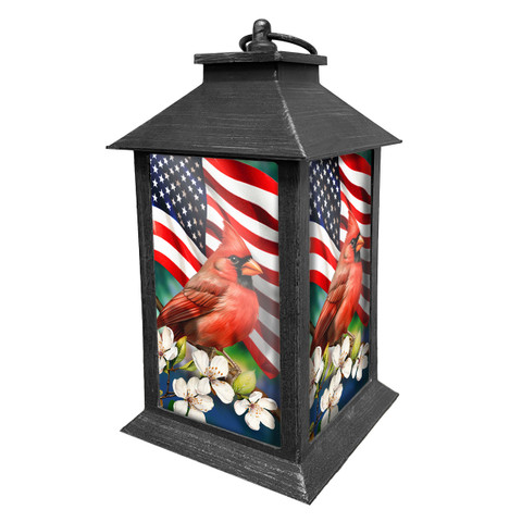 American Cardinal Lantern with red cardinals, white flowers, and American flag design on black metal.
