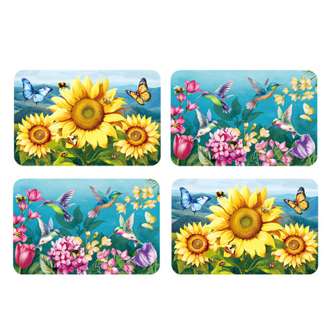 Four colorful square placemats with sunflowers, hummingbirds, butterflies, and flowers on a blue background.