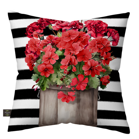 Striped Geraniums Indoor/Outdoor Pillow with black and white stripes and red flowers on a wooden planter.