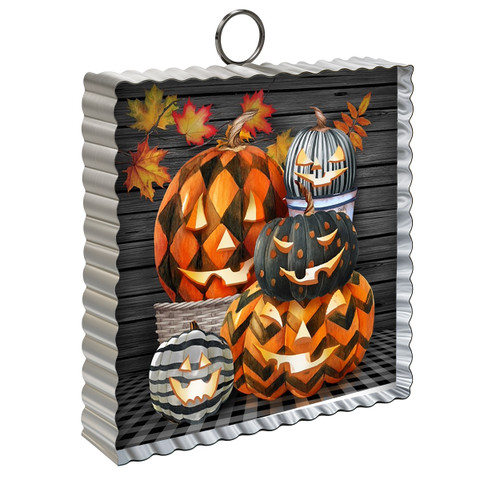Patterned Jack-O-Lanterns Metal Mini Moment with autumn leaves on a wooden background decoration.