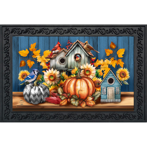 Fall Feathered Friends Doormat with birdhouses, pumpkins, sunflowers, and leaves on a blue background.