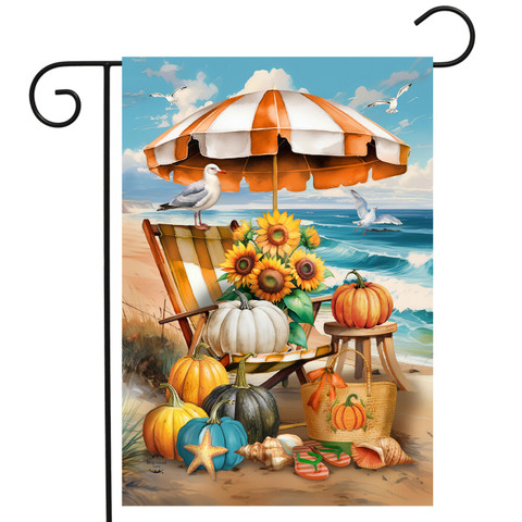 Harvest Beachfront Garden Flag with sunflowers, pumpkins, and beach chair under orange umbrella.