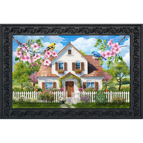 Church in Spring Doormat with white house, pink flowers, birds, and white picket fence design.