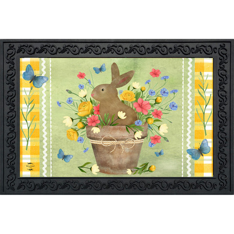 Brown bunny in a flowerpot with colorful flowers and butterflies on a green background doormat.
