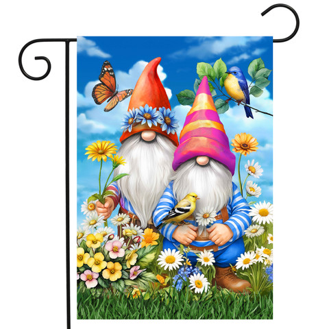 Gnomes in the Garden flag with colorful gnomes, flowers, butterfly, and birds on a blue background.