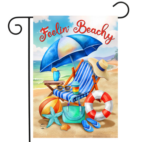 Feelin Beachy Garden Flag with beach chair, umbrella, and accessories on sandy beach scene.
