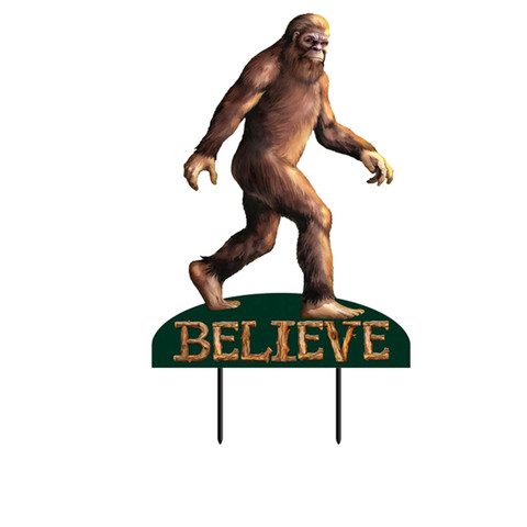 Brown Bigfoot metal art statue on green base with "BELIEVE" text, large mythical creature sculpture.