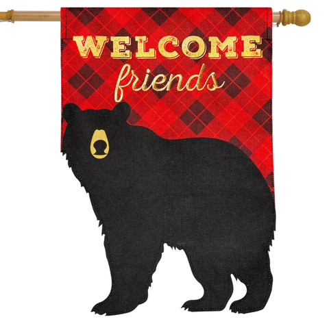 Black bear on red plaid burlap house flag with "Welcome Friends" in gold lettering displayed.