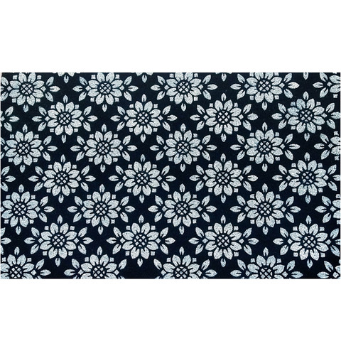 Geometric floral pattern on black coir doormat with white flowers and leaves, 30 x 48 inches.