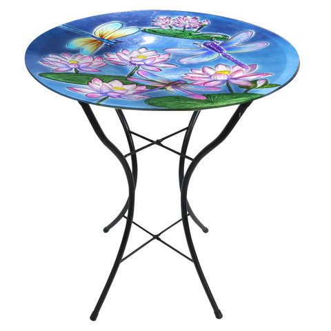 Dragonflies and Water Lilies Glass Birdbath with black metal stand and colorful floral design on top.