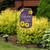 Briarwood Lane Welcome Y'all jar garden flag with colorful spring flowers on a decorative yard display.