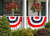 Briarwood Lane Patriotic Bunting, 48" x 24", on a porch with american flag design.