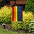Briarwood Lane Rainbow Embroidered Garden Flag, colorful LGBTQ pride flag on a small decorative yard pole.