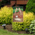 Briarwood Lane No Place Like Home spring garden flag with colorful, printed, decorative design on display.