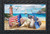 Briarwood Lane Sea To Shining Sea beach scene with patriotic nautical elements and seashells on sand.