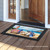 Briarwood Lane Sea To Shining Sea nautical doormat with American flag beach scene and patriotic colors.