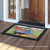 Briarwood Lane small printed Day On The Farm Spring doormat on wooden porch with colorful design.