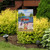 Briarwood Lane Dockside Garden Flag with colorful lake scene and Adirondack chairs on a garden stand.