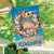 Briarwood Lane Driftwood Wreath Summer House Flag with colorful beach scene and welcome message outdoors.