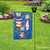 Briarwood Lane small printed garden flag on wrought iron stand, colorful seasonal decorative yard display.