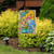 Briarwood Lane small printed garden flag with colorful beach theme and flip flops on sunny porch.