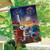 Briarwood Lane Beachfront Fireworks flag with patriotic shore scene, lighthouse, stars, and stripes on display.