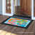 Briarwood Lane Summer Flip Flops Nautical Doormat with colorful nautical design on wooden porch floor.