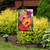 Briarwood Lane Garden Gerber Daisies spring garden flag with colorful butterflies on a decorative yard display.