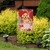 Briarwood Lane Valentine's Puppy Garden Flag with pink hearts, red balloons and happy dog.