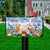 Briarwood Lane Easter Egg Hunt Mailbox Cover with colorful bunny, eggs, and flowers on small decorative display.