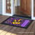 Briarwood Lane Mardi Gras doormat with colorful mask and "Laissez les bons temps rouler" on porch.