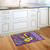 Briarwood Lane Mardi Gras doormat with colorful, cheery design on purple background, perfect for festive home decor.
